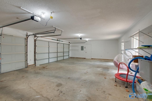 garage with electric panel and a garage door opener