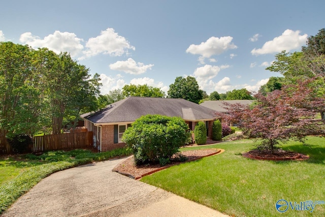 view of front facade featuring brick siding and concrete driveway