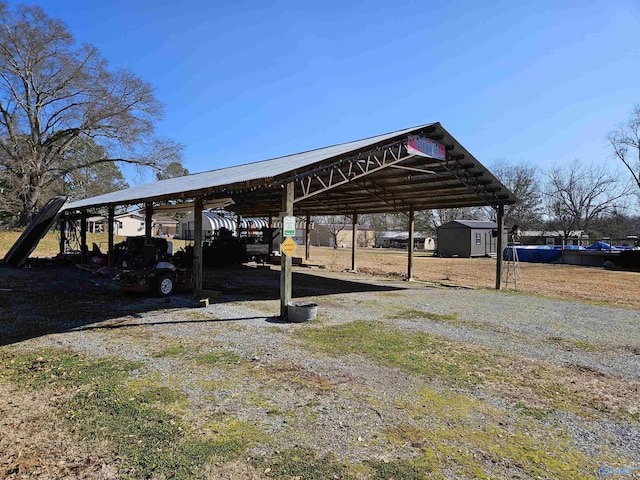 view of parking / parking lot featuring a carport