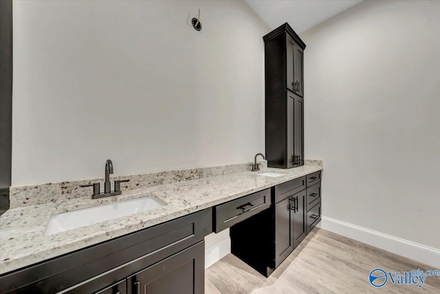 bathroom with hardwood / wood-style floors and vanity