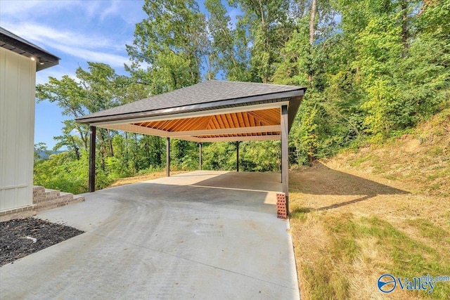 view of car parking featuring driveway and a carport