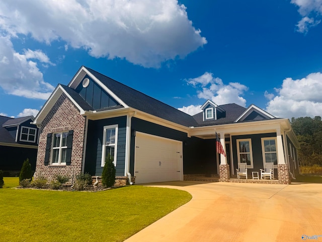 craftsman-style home featuring a porch, a garage, and a front yard