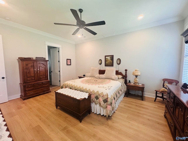 bedroom with ornamental molding, ceiling fan, and light hardwood / wood-style flooring