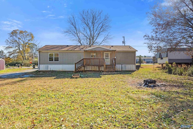 back of house featuring a yard