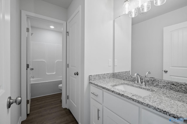 REVERE2 Saddle St, New Market, AL 35761 - bathroom featuring toilet, vanity, shower / washtub combination, and wood finished floors