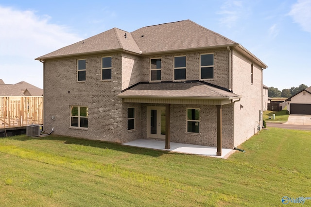 REVERE2 Saddle St, New Market, AL 35761 - rear view of property with cooling unit, fence, a patio area, brick siding, and a lawn