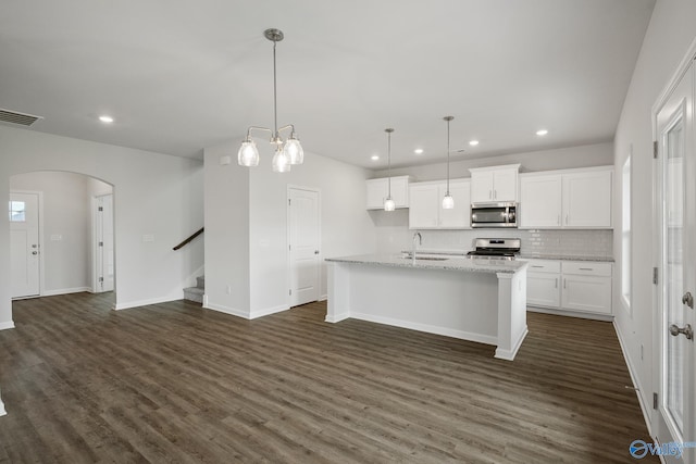 REVERE2 Saddle St, New Market, AL 35761 - kitchen with dark wood-style flooring, a sink, arched walkways, visible vents, and appliances with stainless steel finishes
