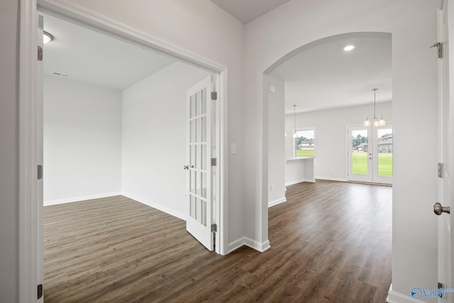 REVERE2 Saddle St, New Market, AL 35761 - hall with dark wood-style flooring, a chandelier, baseboards, arched walkways, and french doors