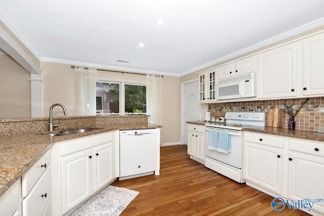 1867 Shellbrook Dr, Huntsville, AL 35806 - kitchen with white appliances, a sink, light wood-type flooring, tasteful backsplash, and ornamental molding