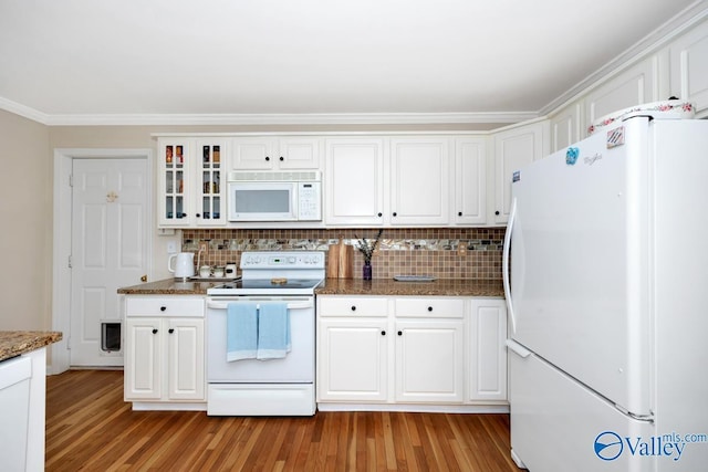 1867 Shellbrook Dr, Huntsville, AL 35806 - kitchen featuring white appliances, light wood finished floors, backsplash, white cabinetry, and ornamental molding