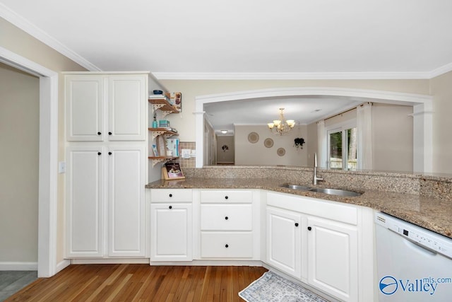 1867 Shellbrook Dr, Huntsville, AL 35806 - kitchen with white dishwasher, a sink, a chandelier, light stone countertops, and wood finished floors