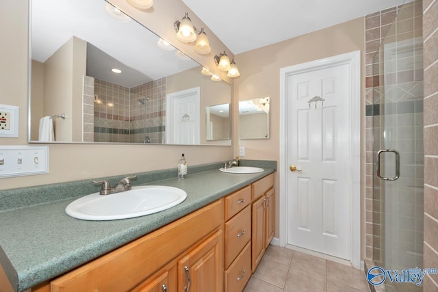 1867 Shellbrook Dr, Huntsville, AL 35806 - bathroom featuring a tile shower, tile patterned floors, and double vanity