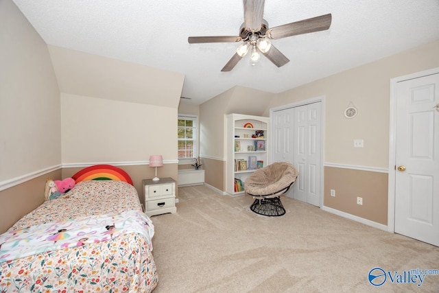 1867 Shellbrook Dr, Huntsville, AL 35806 - bedroom with carpet floors, lofted ceiling, a closet, a ceiling fan, and baseboards