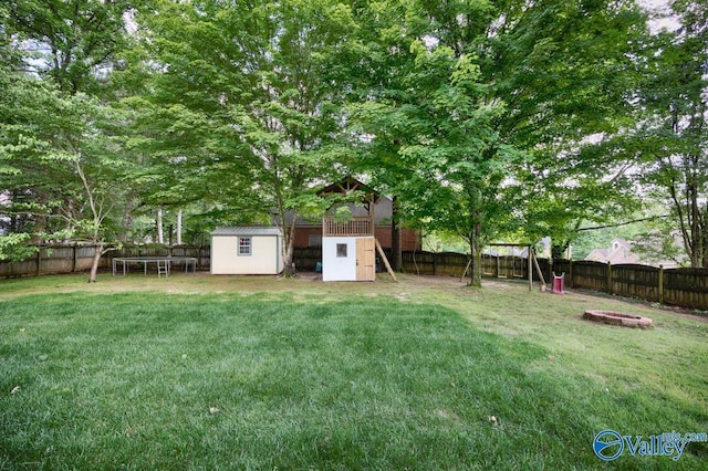 1867 Shellbrook Dr, Huntsville, AL 35806 - view of yard with a trampoline, an outdoor fire pit, and a playground