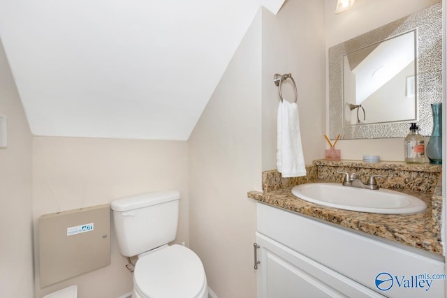 1867 Shellbrook Dr, Huntsville, AL 35806 - half bathroom with lofted ceiling, vanity, and toilet