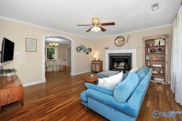 1867 Shellbrook Dr, Huntsville, AL 35806 - living room featuring ceiling fan, arched walkways, a textured ceiling, hardwood / wood-style floors, and a chandelier