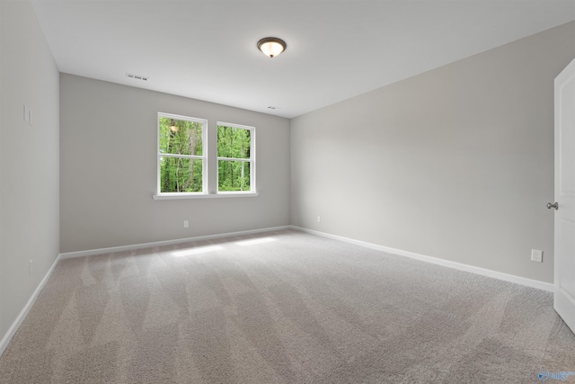 208 Hibiscus Dr, Hazel Green, AL 35750 - empty room with visible vents, carpet flooring, and baseboards