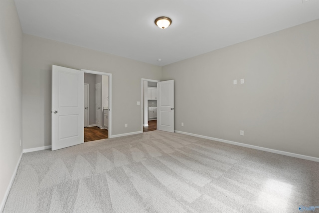 208 Hibiscus Dr, Hazel Green, AL 35750 - unfurnished bedroom featuring ensuite bathroom, baseboards, and carpet floors
