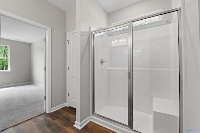 208 Hibiscus Dr, Hazel Green, AL 35750 - full bath with a shower stall, wood finished floors, and baseboards