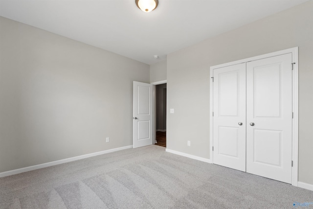 208 Hibiscus Dr, Hazel Green, AL 35750 - unfurnished bedroom featuring a closet, carpet, and baseboards