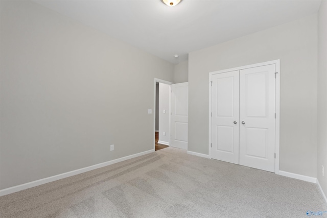 208 Hibiscus Dr, Hazel Green, AL 35750 - unfurnished bedroom with a closet, carpet floors, and baseboards
