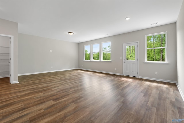 208 Hibiscus Dr, Hazel Green, AL 35750 - unfurnished living room featuring visible vents, dark wood-style floors, and baseboards