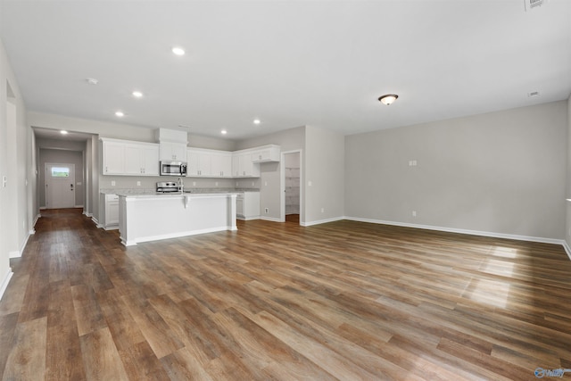 208 Hibiscus Dr, Hazel Green, AL 35750 - unfurnished living room with wood finished floors, recessed lighting, and baseboards