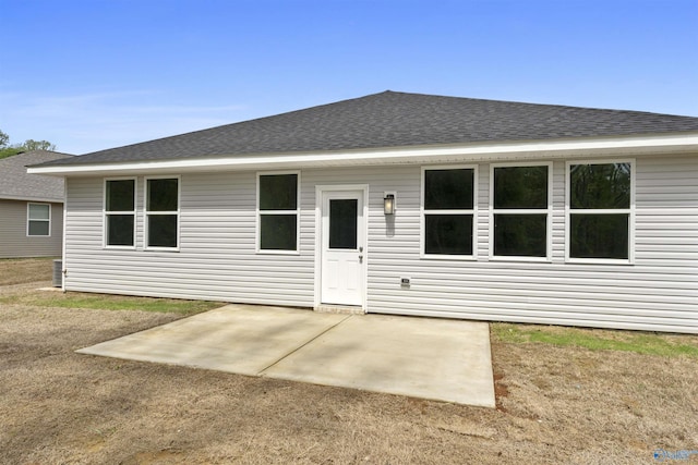 208 Hibiscus Dr, Hazel Green, AL 35750 - back of house featuring a patio area and roof with shingles