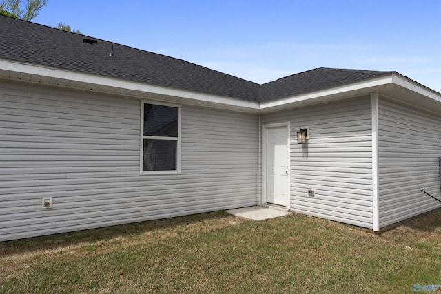 208 Hibiscus Dr, Hazel Green, AL 35750 - property entrance featuring a lawn and a shingled roof