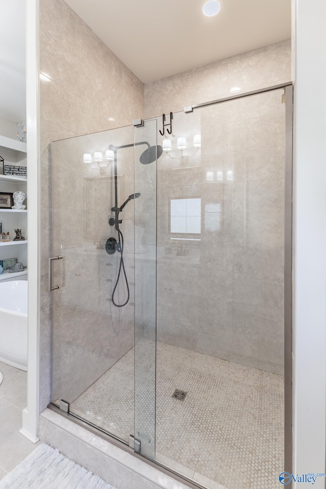 bathroom with plus walk in shower and tile patterned flooring