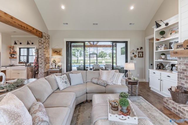 living room featuring brick wall, vaulted ceiling, and dark wood-type flooring