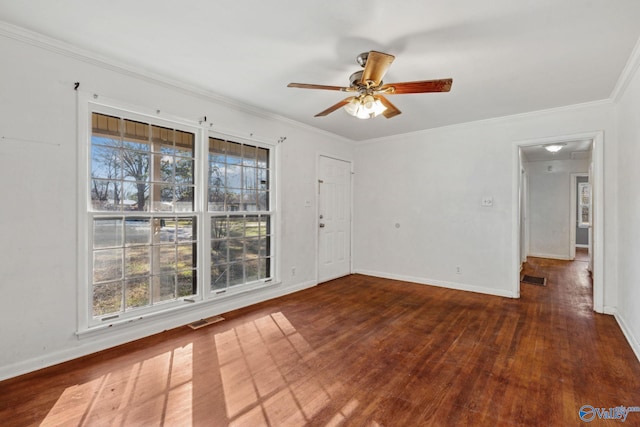 unfurnished room featuring ornamental molding, a wealth of natural light, dark wood-type flooring, and ceiling fan