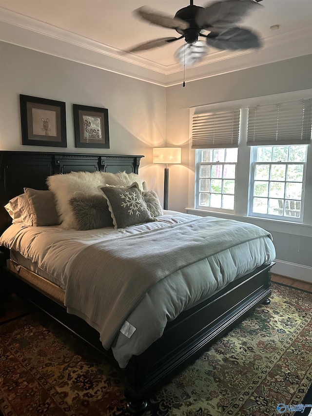 bedroom featuring crown molding and ceiling fan