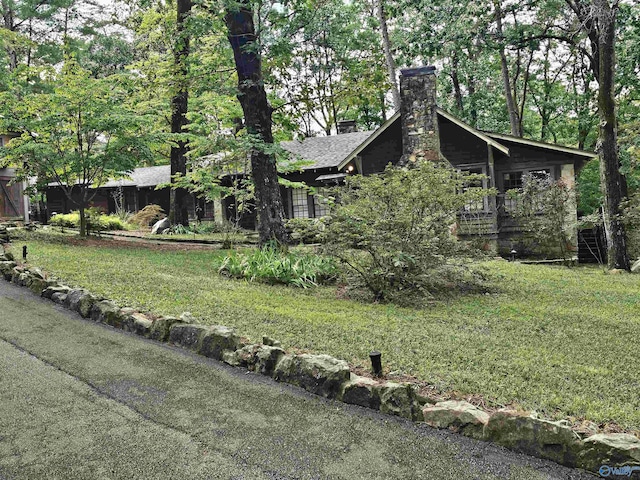 view of home's exterior with a yard