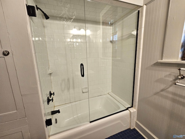 bathroom featuring tile patterned floors and enclosed tub / shower combo