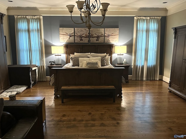 bedroom featuring hardwood / wood-style flooring, a notable chandelier, and crown molding