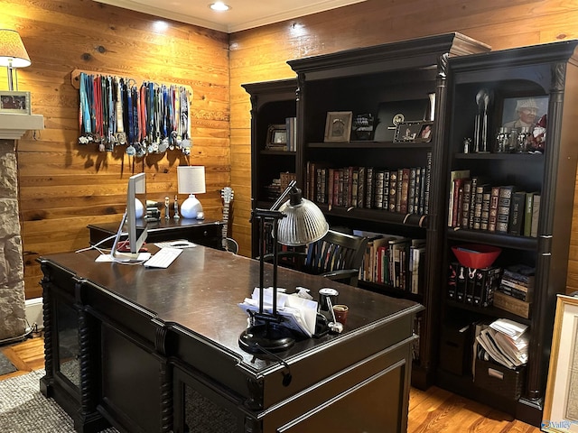 office space with wooden walls and light hardwood / wood-style floors