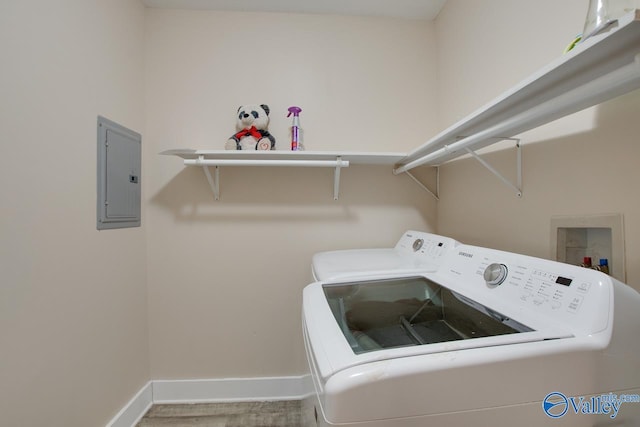 washroom featuring electric panel and washer and dryer