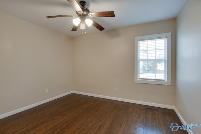 unfurnished room with dark hardwood / wood-style flooring and ceiling fan