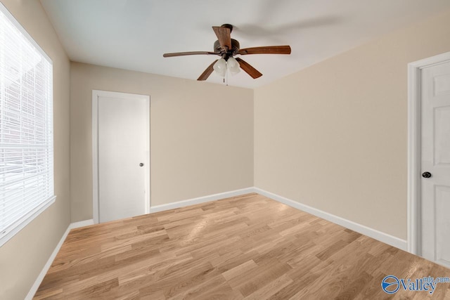 unfurnished room featuring light hardwood / wood-style flooring and ceiling fan