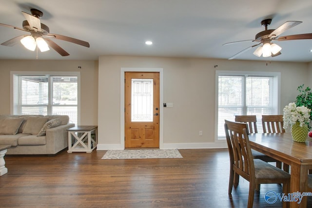 dining space with plenty of natural light, dark hardwood / wood-style floors, and ceiling fan