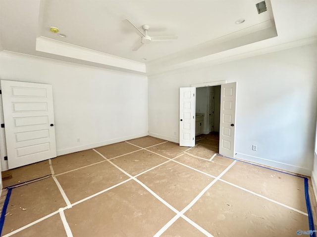 unfurnished bedroom featuring ornamental molding, a raised ceiling, and ceiling fan