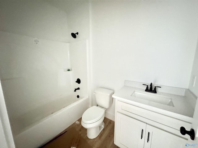 full bathroom featuring vanity, hardwood / wood-style flooring, toilet, and shower / bath combination