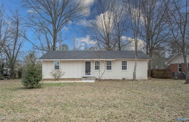 single story home with crawl space, a front yard, fence, and brick siding