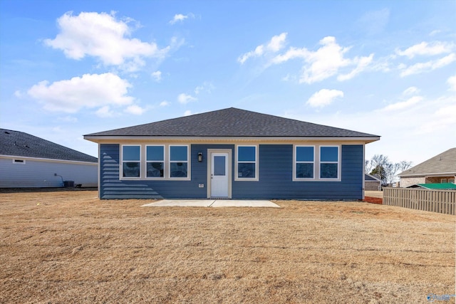 view of front of property with a patio area and a front lawn