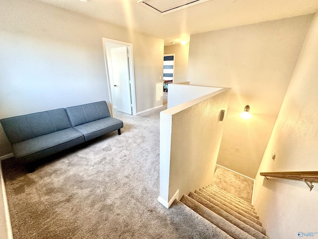 carpeted living room featuring baseboards