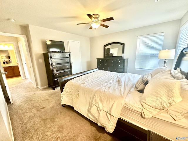 bedroom with light carpet, ceiling fan, and baseboards