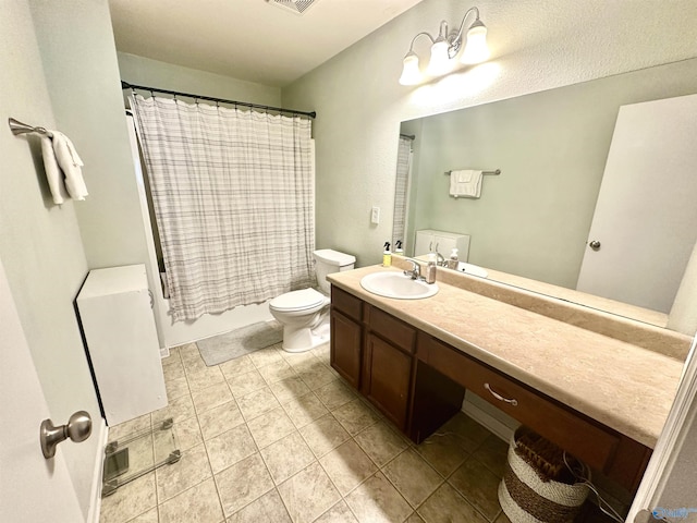 bathroom with visible vents, vanity, toilet, and shower / bath combo with shower curtain