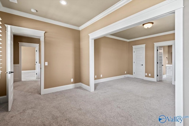 carpeted empty room featuring ornamental molding