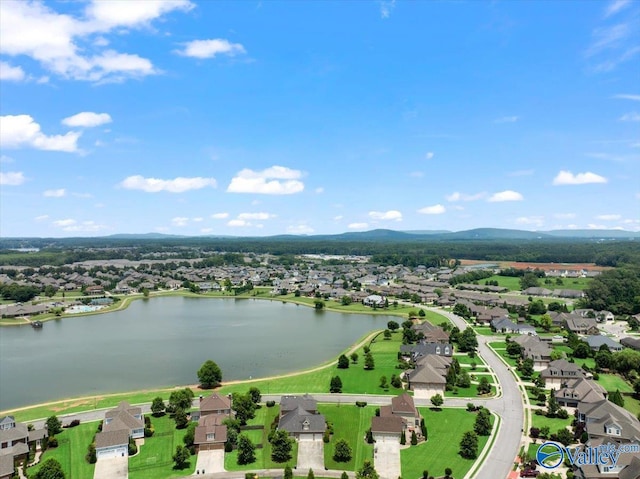 drone / aerial view featuring a water and mountain view